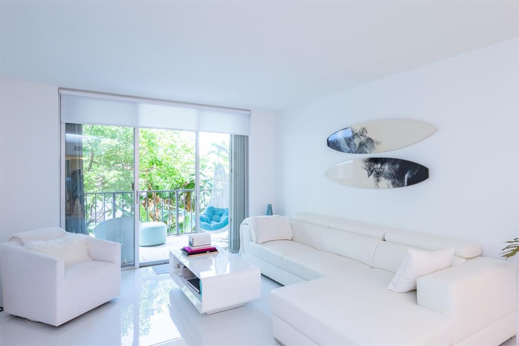 3581 South Ocean Boulevard, Unit 2B Palm Beach, FL 33480 - Photo 7 of 41 a living room with furniture and a large window