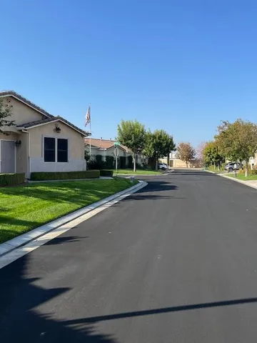a view of a house with a yard and a garage