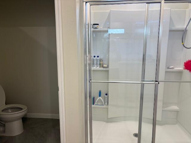 571 Old Country Rd S East Palm Bay, FL 32909 - Photo 15 of 37 a bathroom with a toilet and a shower