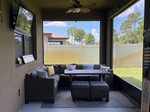 571 Old Country Rd S East Palm Bay, FL 32909 - Photo 22 of 37 a living room with furniture and a large window
