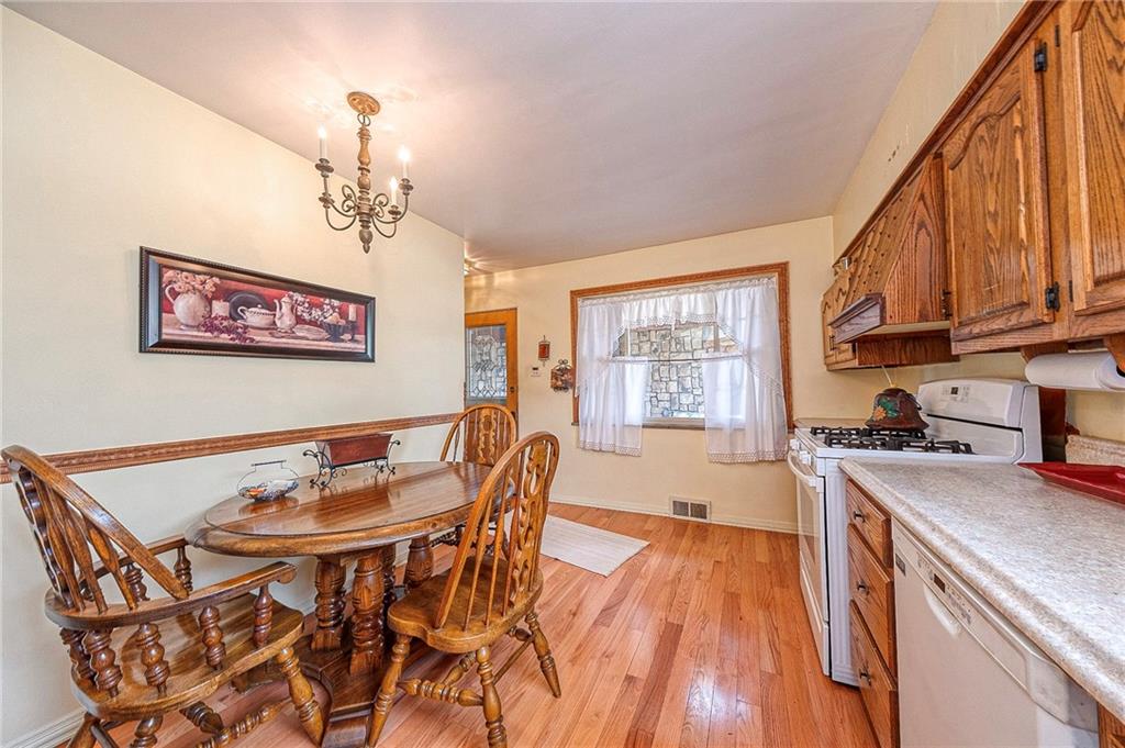 699 Kaye Avenue Monaca, PA 15061 - Photo 14 of 43 a view of a dining room with furniture window and wooden floor