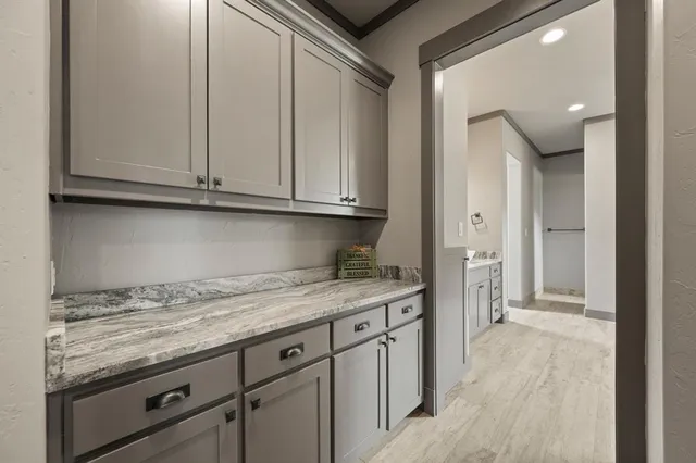 a view of a kitchen with granite countertop cabinets