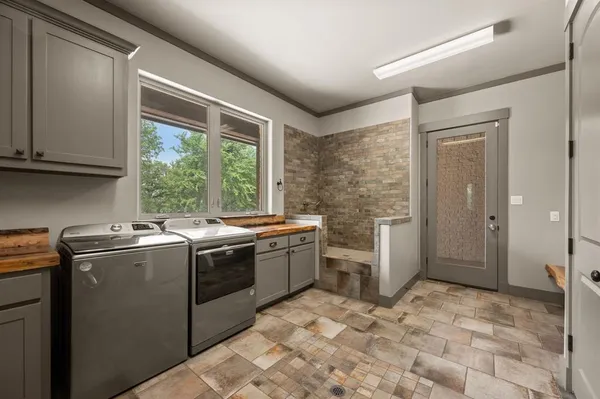 a view of a kitchen with refrigerator and stove