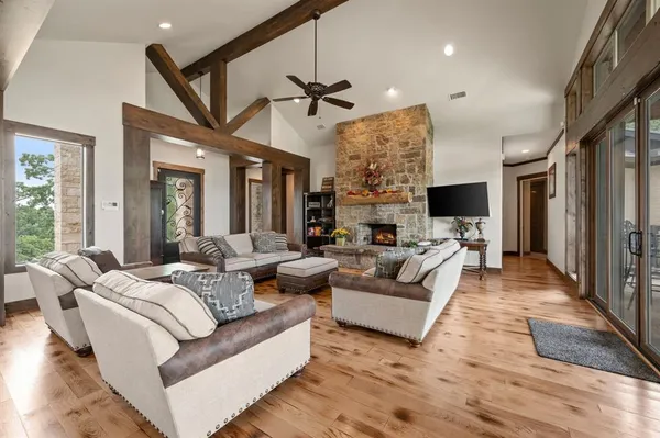 a living room with furniture ceiling fan and a rug