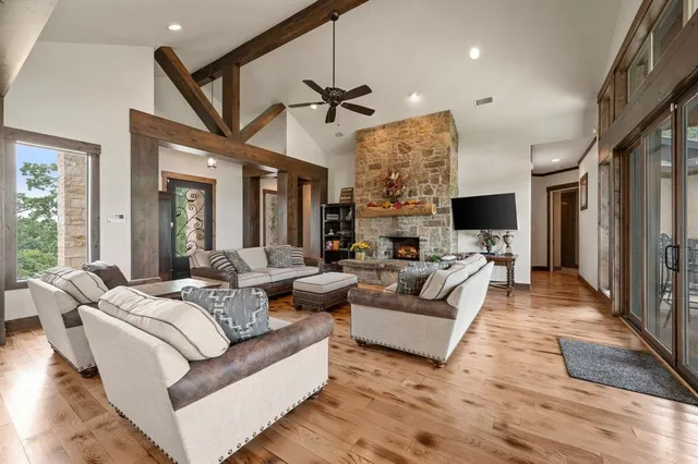 a living room with furniture ceiling fan and a rug