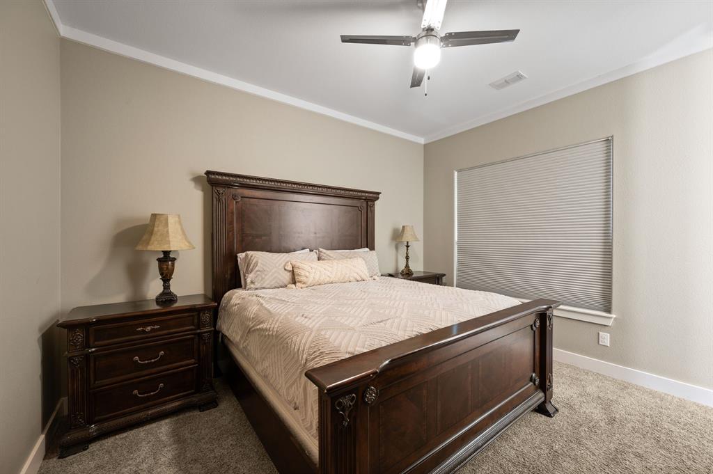 248 Howard Road Valley View, TX 76272 - Photo 23 of 39 a bedroom with a bed and a dresser