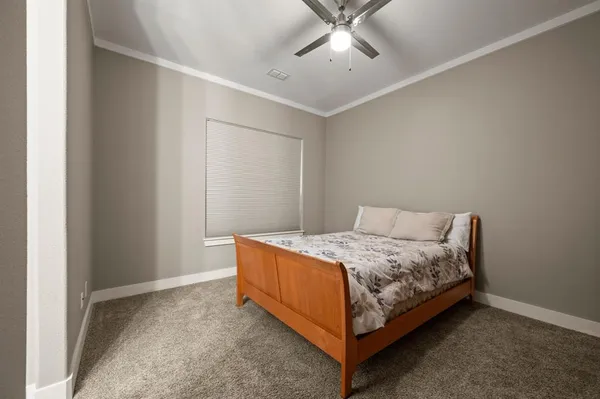 a bedroom with a bed and window