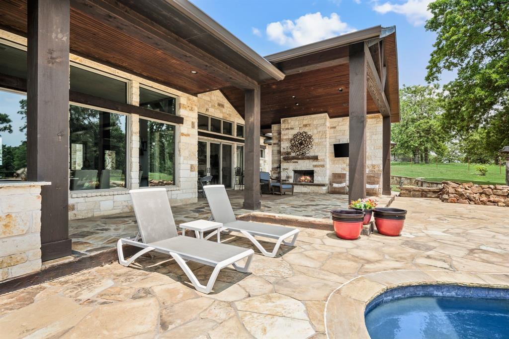 248 Howard Road Valley View, TX 76272 - Photo 29 of 39 a building outdoor space with patio furniture and potted plants