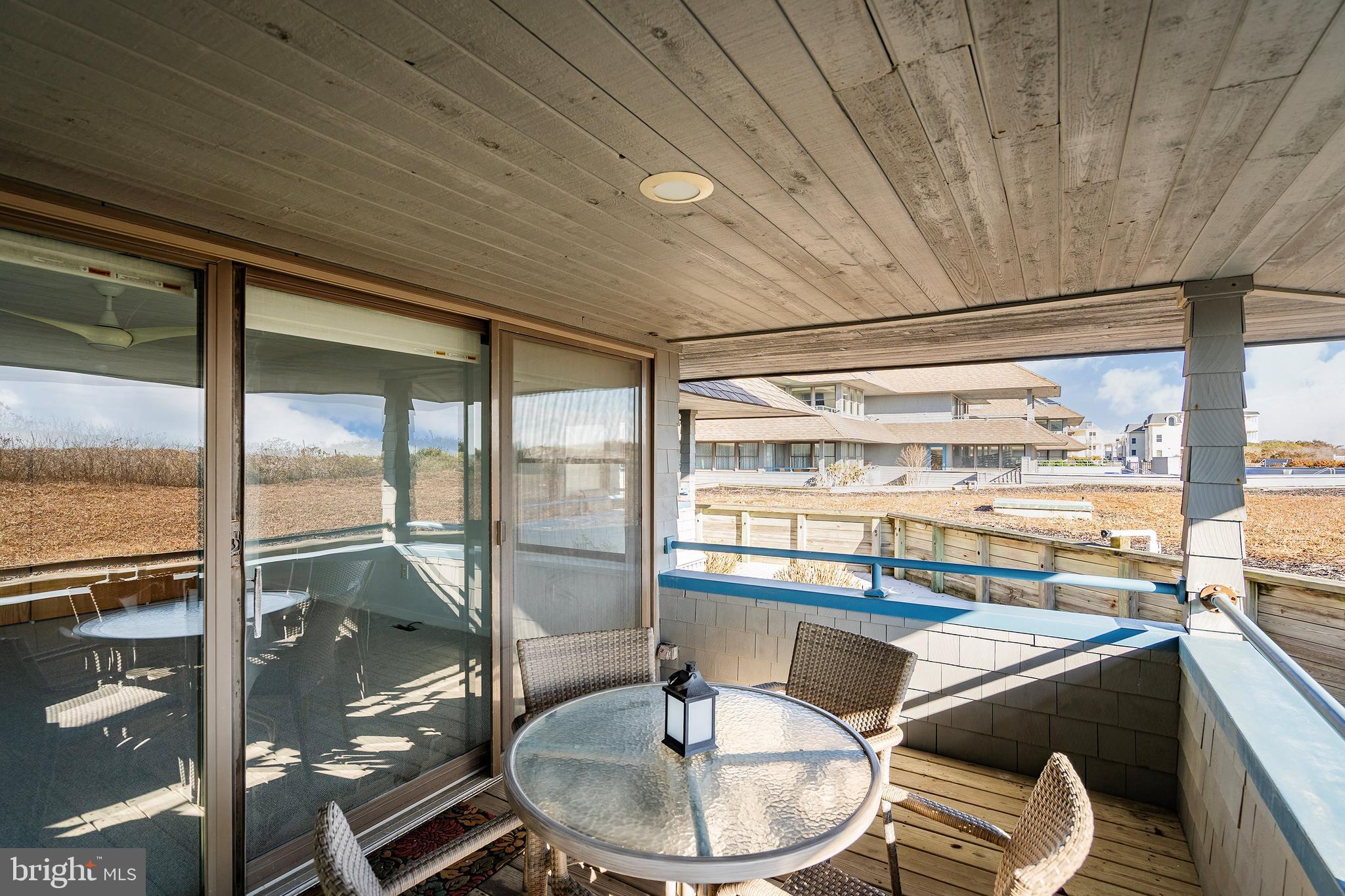 1001 Ocean Avenue, Unit 1017 Ship Bottom, NJ 08008 - Photo 18 of 31 a dining room with a table and chairs