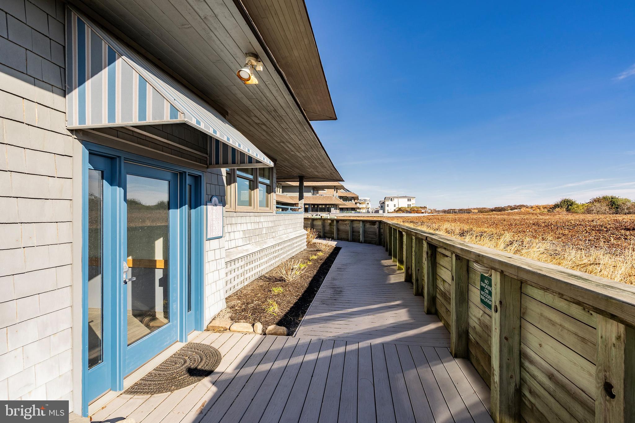 1001 Ocean Avenue, Unit 1017 Ship Bottom, NJ 08008 - Photo 20 of 31 a view of a balcony with wooden floor and staircase