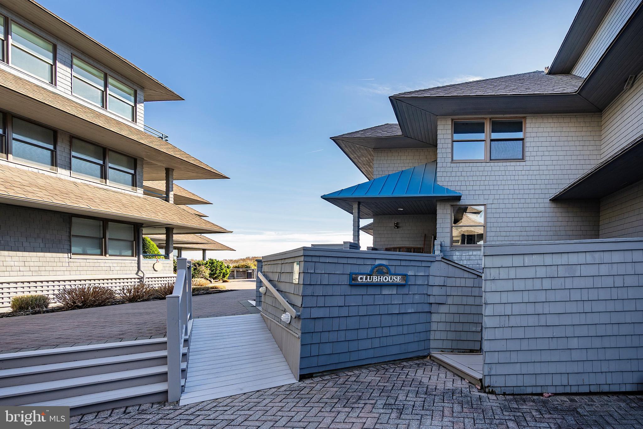 1001 Ocean Avenue, Unit 1017 Ship Bottom, NJ 08008 - Photo 22 of 31 a view of a brick house with many windows