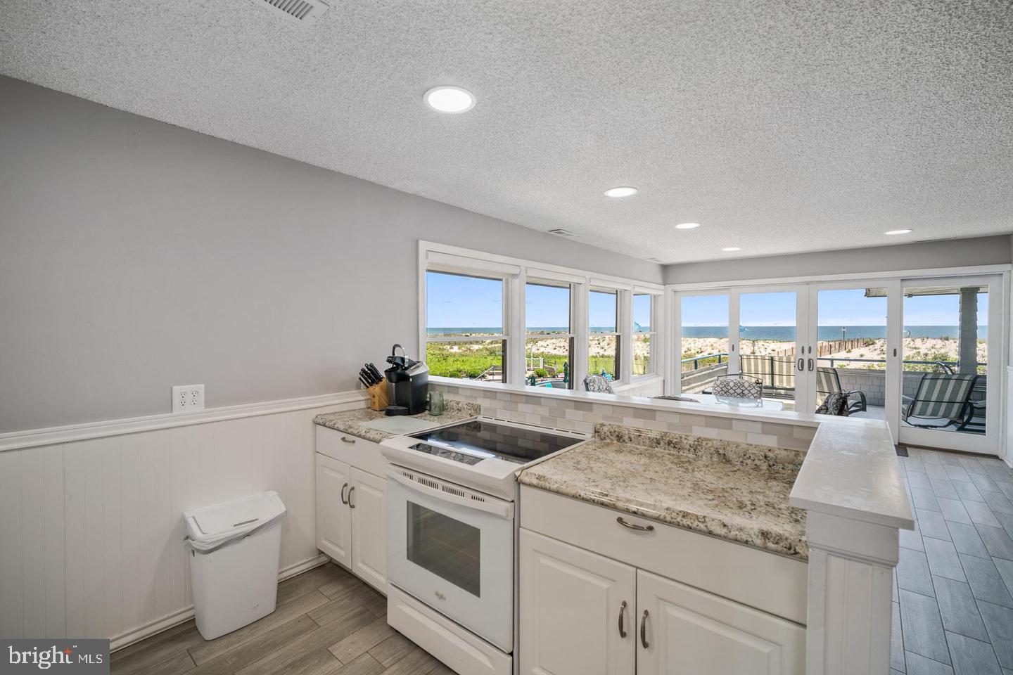 1001 Ocean Avenue, Unit 1017 Ship Bottom, NJ 08008 - Photo 31 of 31 a view of a kitchen with granite countertop a sink and a stove