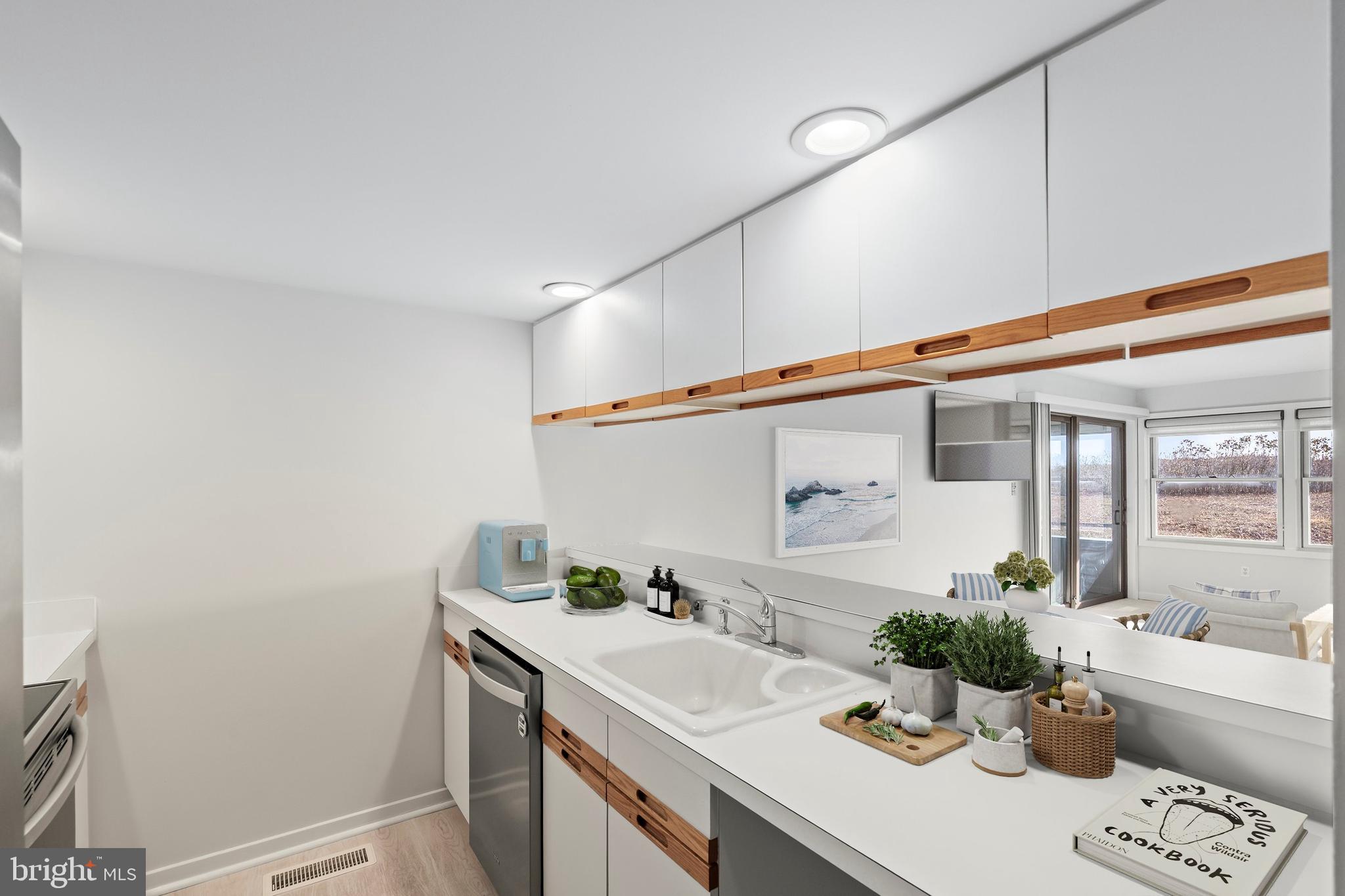1001 Ocean Avenue, Unit 1017 Ship Bottom, NJ 08008 - Photo 9 of 31 a spacious bathroom with a granite countertop sink and a mirror