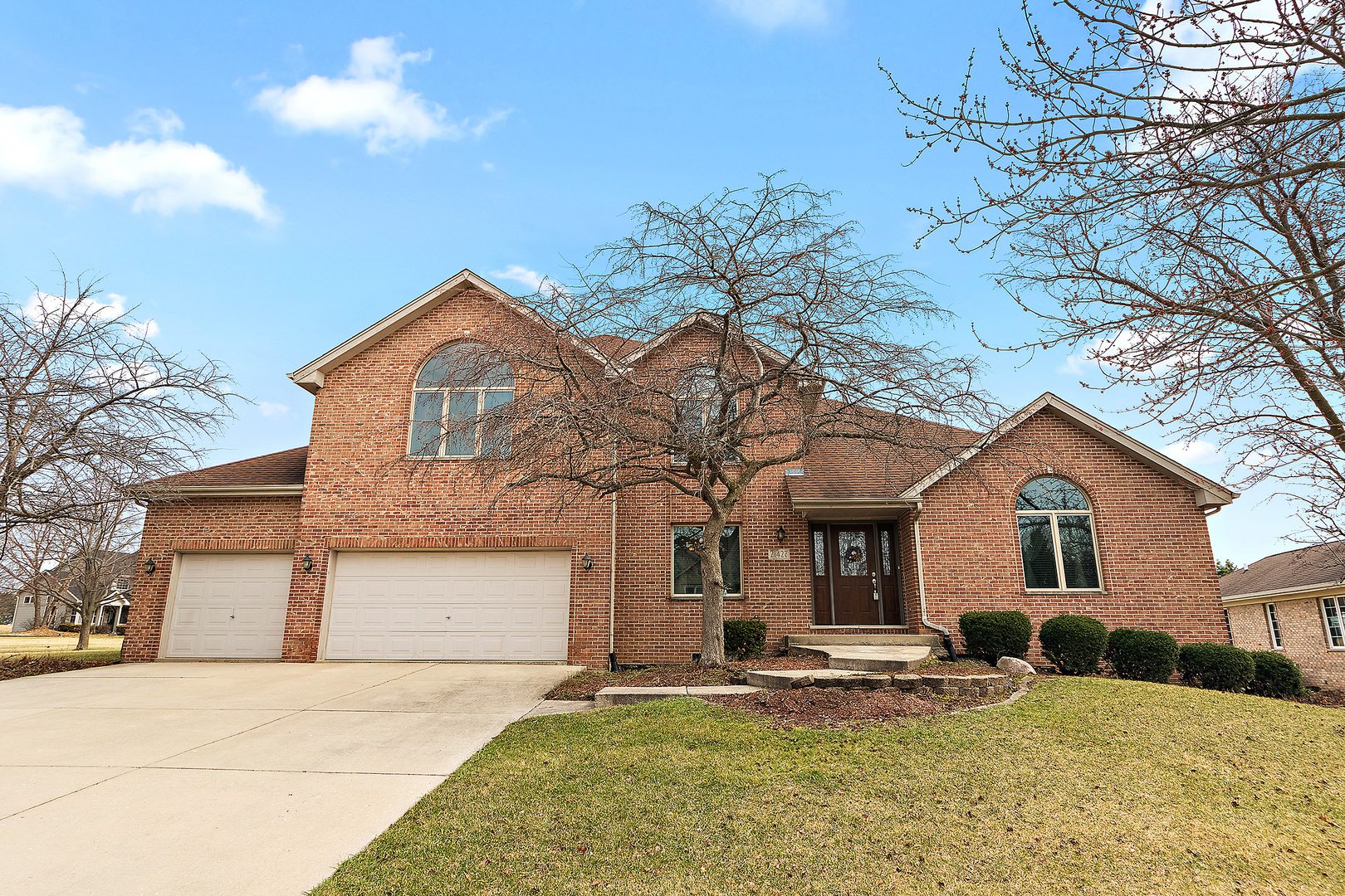 a view of a yard in front of a house