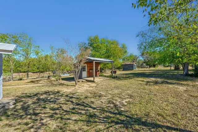 a house with trees in the background