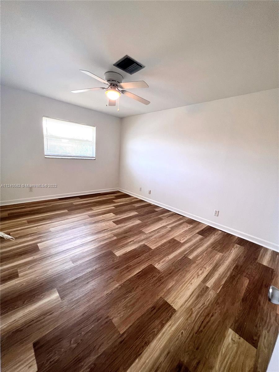 22795 Southwest 66th Avenue, Unit 206 Boca Raton, FL 33428 - Photo 18 of 29 a view of empty room with wooden floor