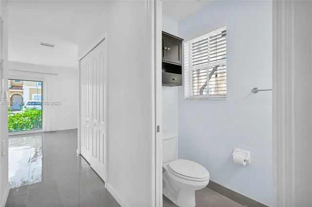 a bathroom with a toilet and a sink