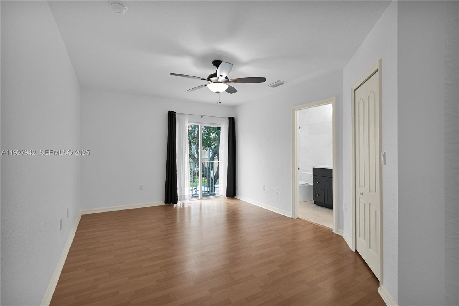 12832 Southwest 30th Street, Unit 118 Miramar, FL 33027 - Photo 14 of 29 a view of an empty room with a window