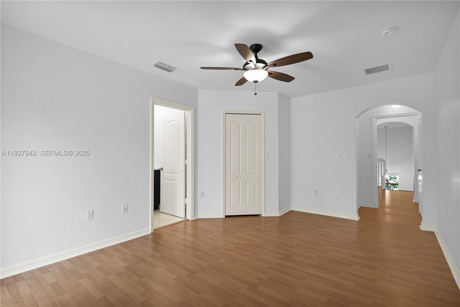 12832 Southwest 30th Street, Unit 118 Miramar, FL 33027 - Photo 16 of 29 a view of empty room with wooden floor