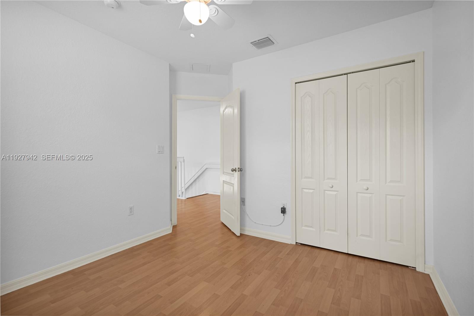 12832 Southwest 30th Street, Unit 118 Miramar, FL 33027 - Photo 22 of 29 wooden floor in an empty room