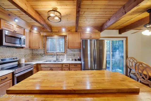 a bathroom with a tub and a sink