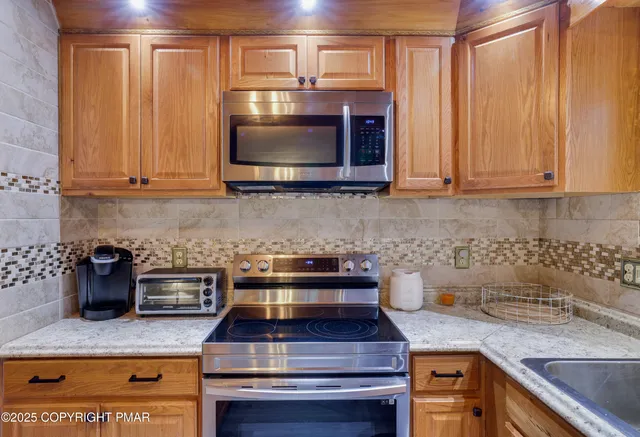 a kitchen with a stove and a microwave