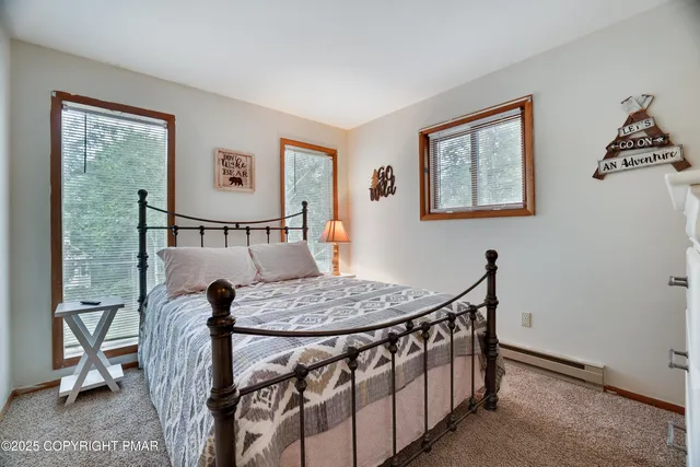 a view of an chairs and table in the room