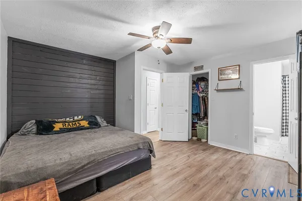 a bedroom with a bed and a walk in closet