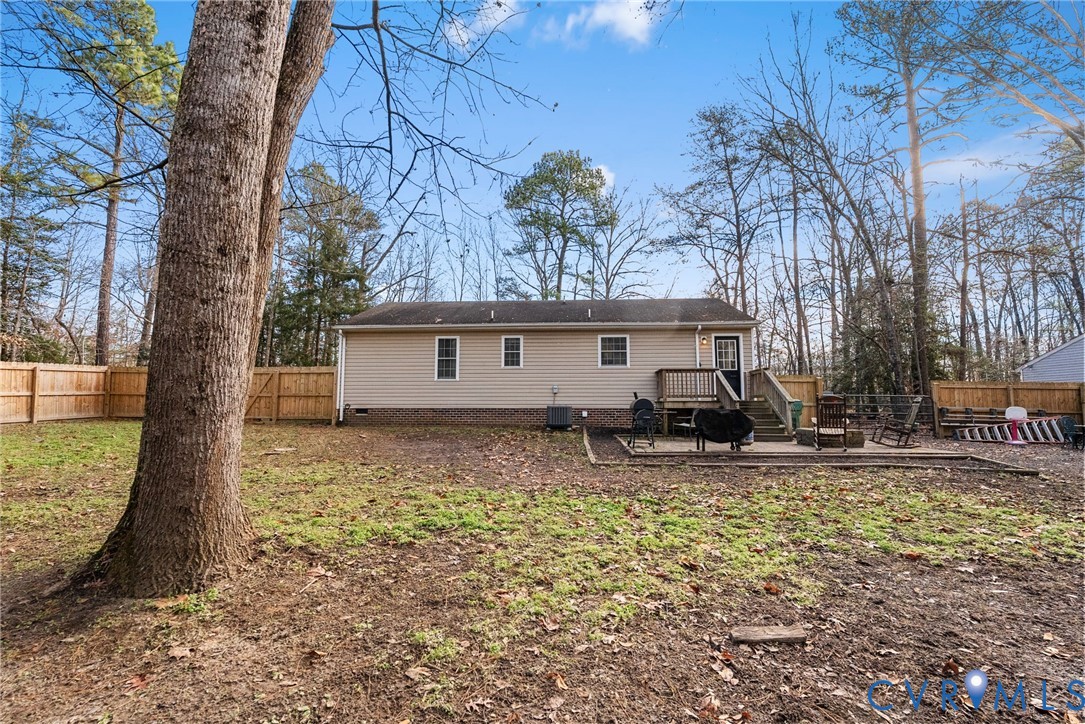 904 Rosebud Run Aylett, VA 23009 - Photo 20 of 20 a house view with a sitting space and trees