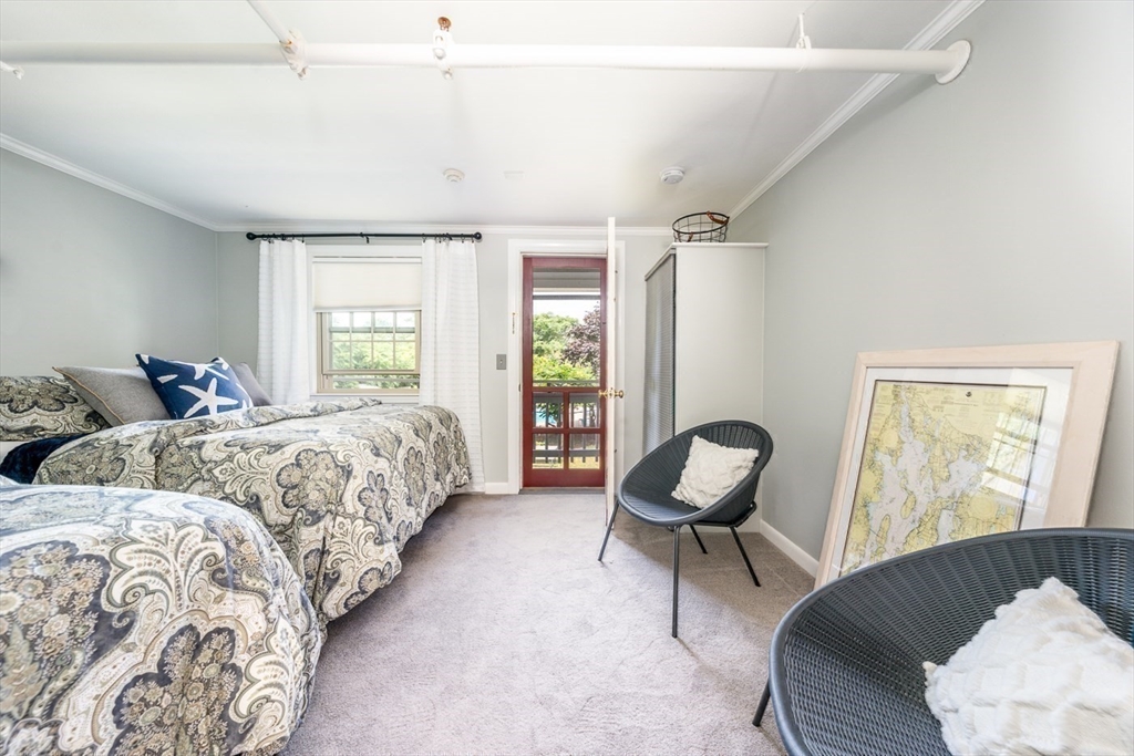 141 Main Street, Unit TH1 Dennis, MA 02660 - Photo 15 of 27 a bedroom with two beds and a large window
