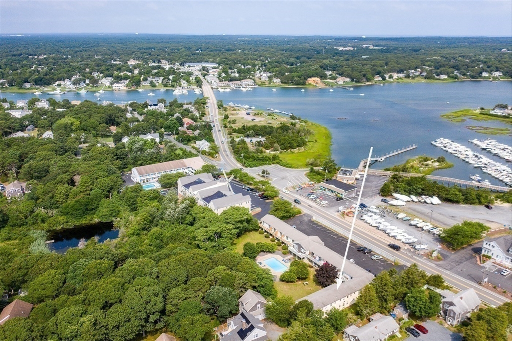 141 Main Street, Unit TH1 Dennis, MA 02660 - Photo 25 of 27 an aerial view of residential houses with outdoor space