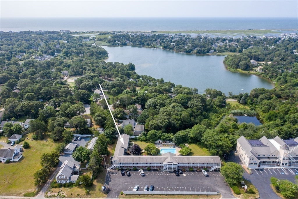 141 Main Street, Unit TH1 Dennis, MA 02660 - Photo 26 of 27 an aerial view of a city with lots of residential buildings lake and ocean view