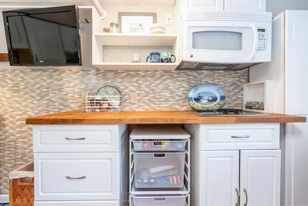 141 Main Street, Unit TH1 Dennis, MA 02660 - Photo 9 of 27 a bathroom with a sink and a mirror