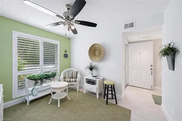 a living room with furniture and a window