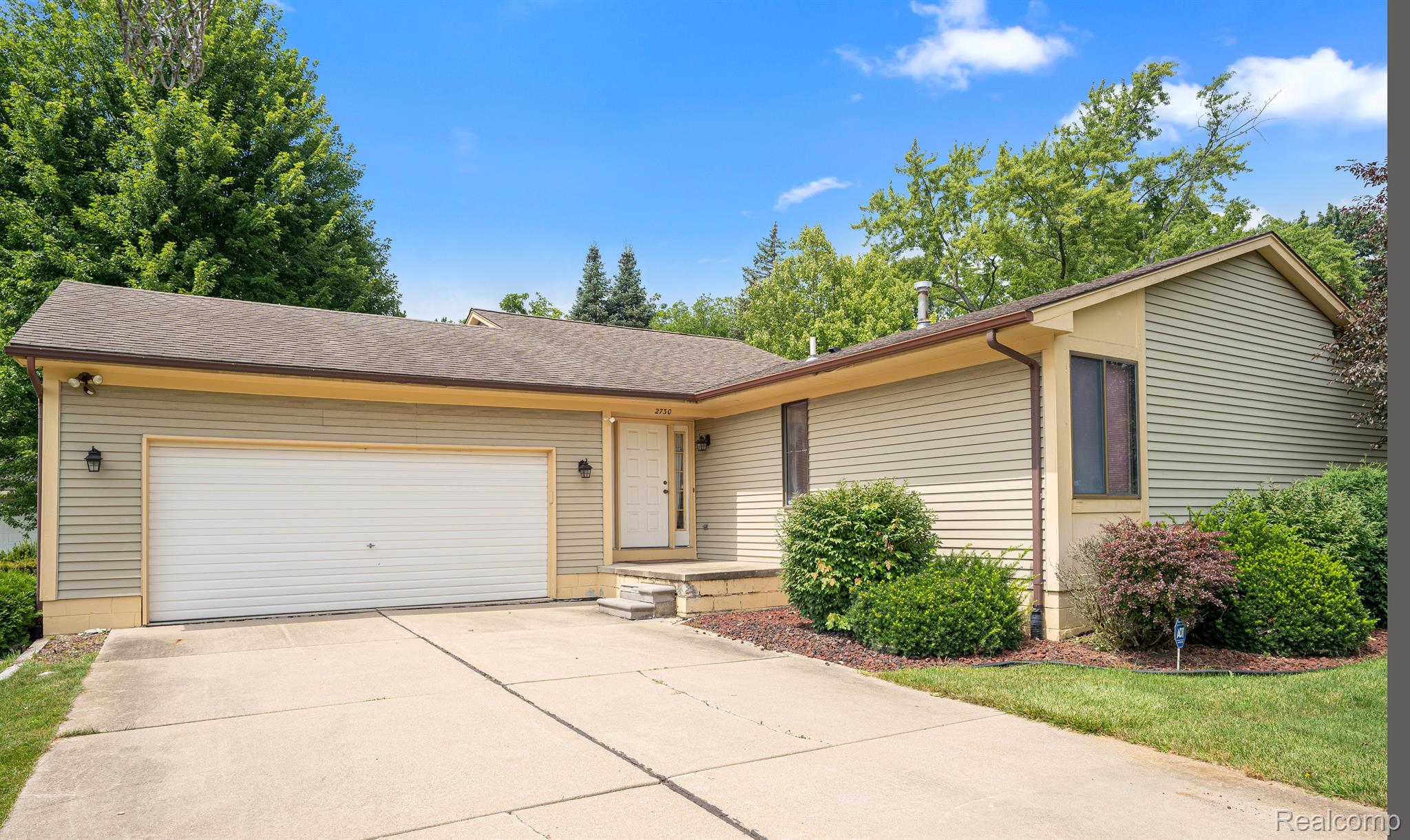 Cute ranch with wide driveway and attached garage