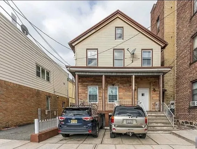 a car parked in front of a house