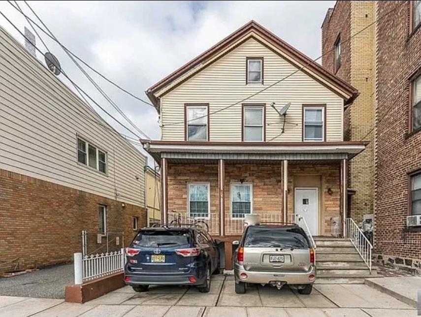 a car parked in front of a house