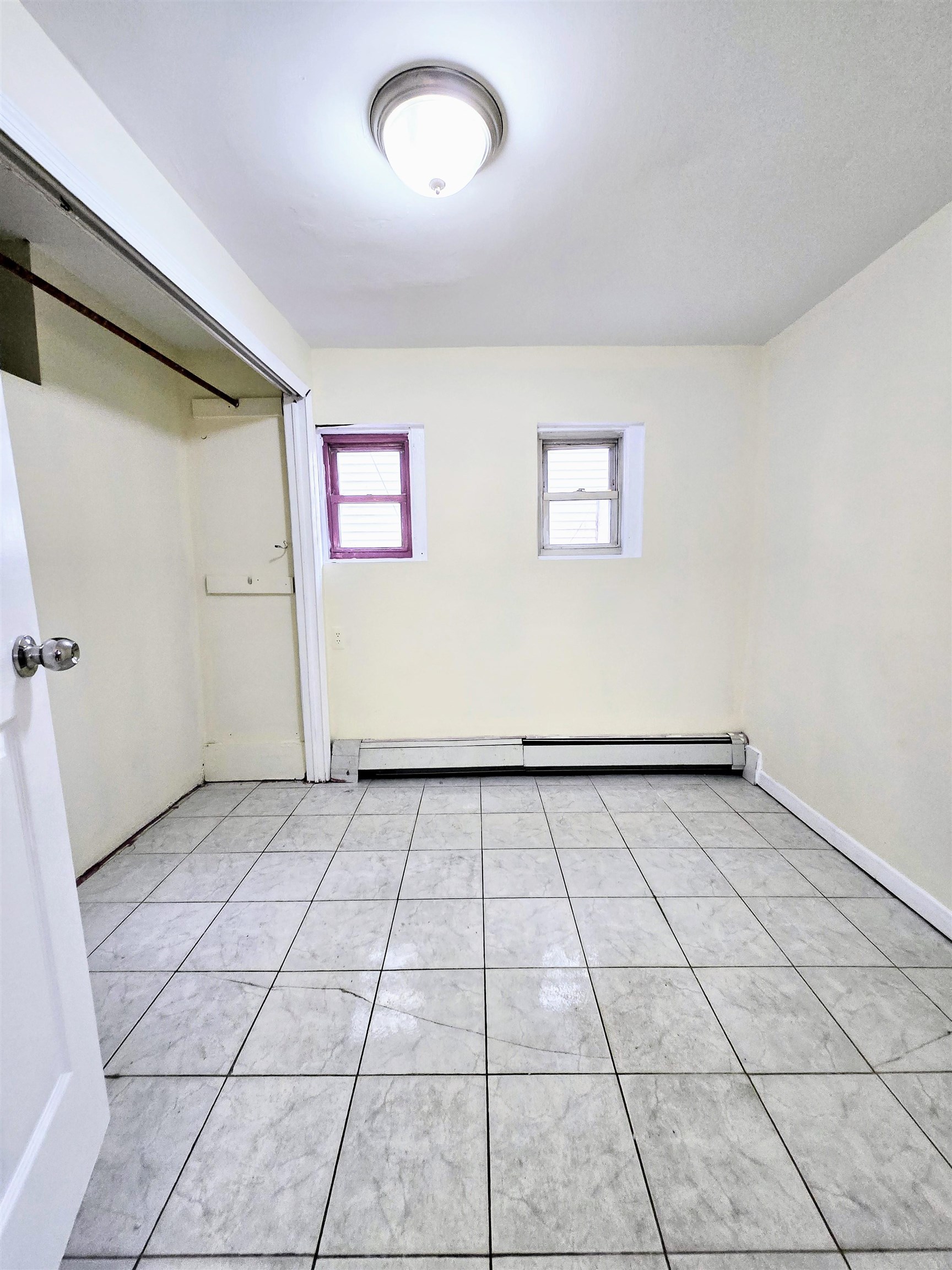 2015 Summit Avenue, Unit B1 Union City, NJ 07087 - Photo 3 of 5 a view of a livingroom with an empty space and a window