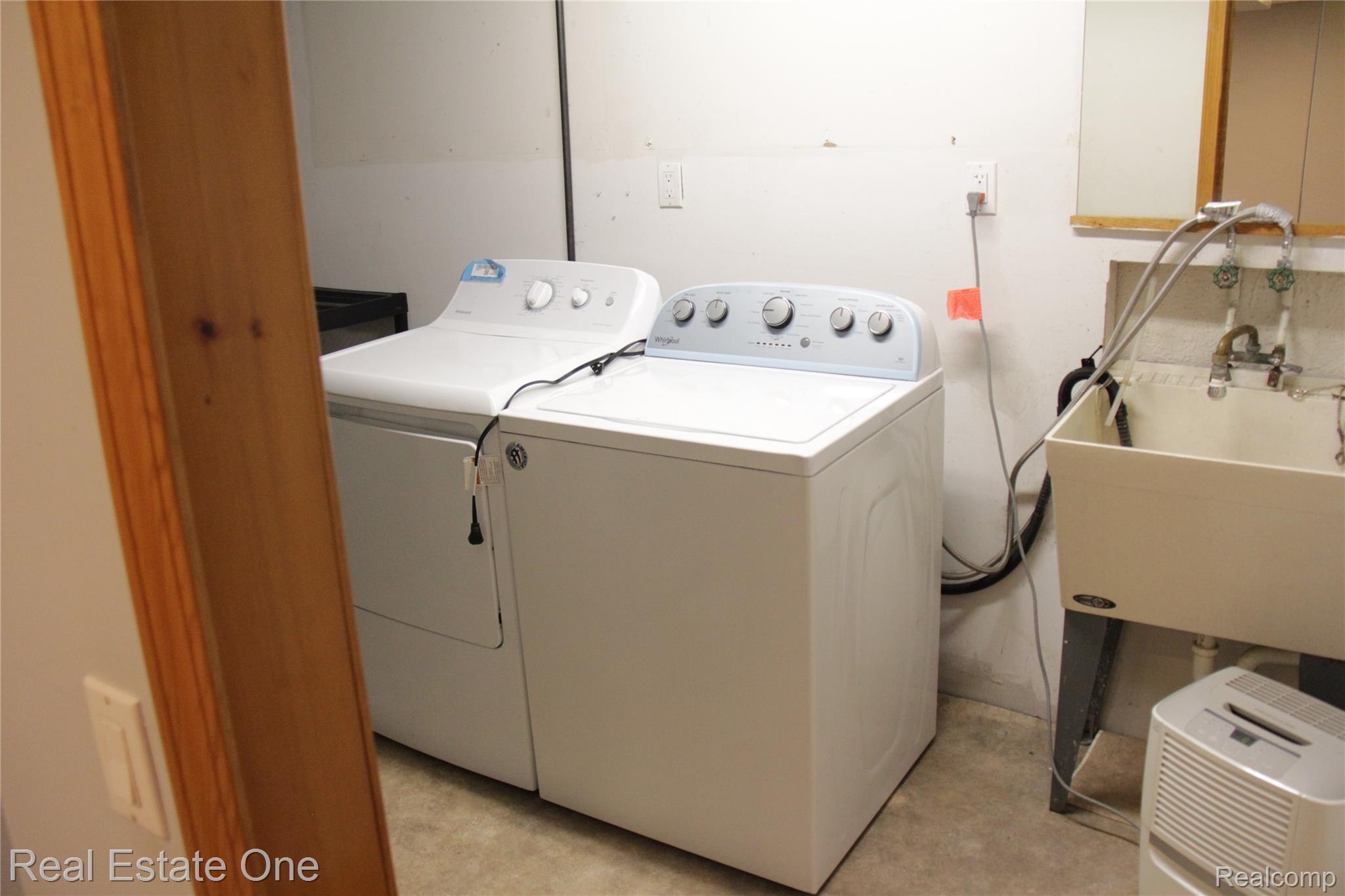 44777 Saltz Road Canton, MI 48187 - Photo 64 of 65 Laundry area featuring a utility sink and existing appliance hookups