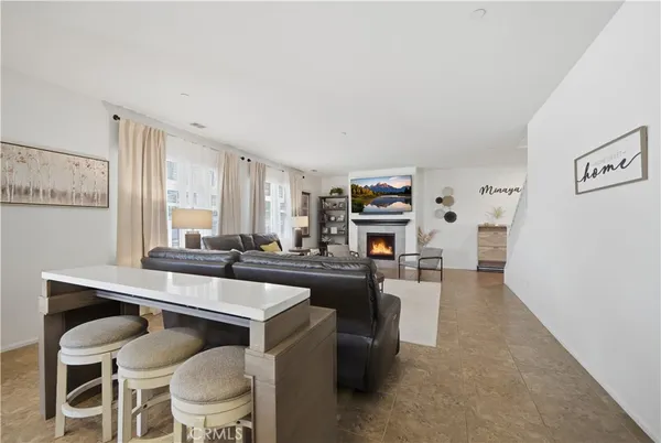 a kitchen with a table chairs stove and cabinets