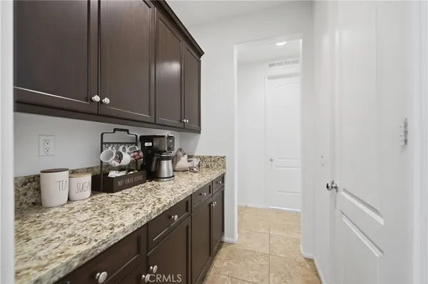 a kitchen with granite countertop cabinets and sink