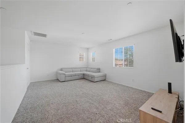 a room with furniture and a window