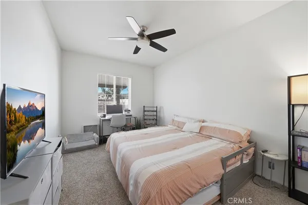 a bedroom with furniture and a window