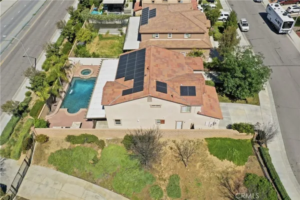 an aerial view of a house with a swimming pool