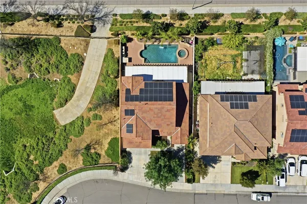 an aerial view of houses with outdoor space