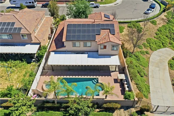an aerial view of residential houses and outdoor space