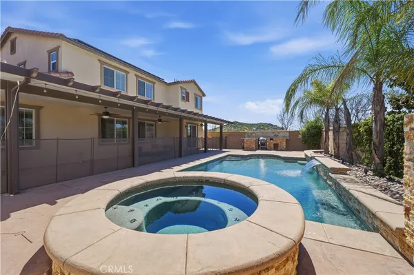 a view of a swimming pool with a lounge chairs