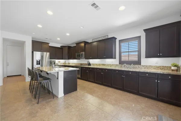 a kitchen with a sink and wooden cabinets