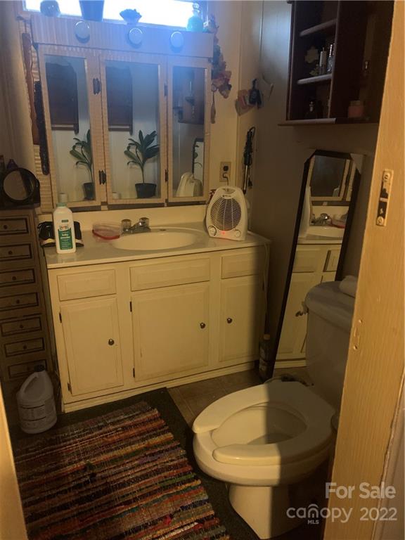 1390 Cove Road Rutherfordton, NC 28139 - Photo 15 of 15 a bathroom with a sink and a mirror