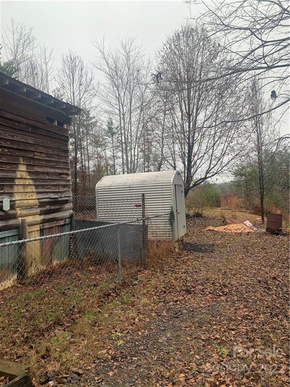 1390 Cove Road Rutherfordton, NC 28139 - Photo 4 of 15 a backyard of a house with barbeque oven